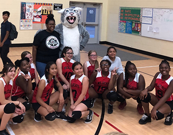 girls volleyball team with the wildcat mascot